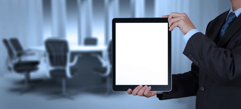 businessman success working with blank tablet computer his board room background