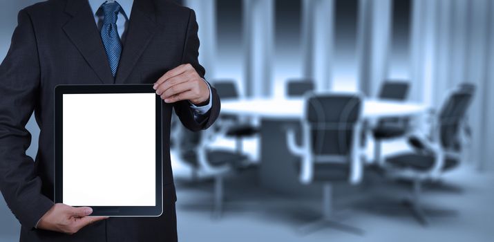 businessman success working with blank tablet computer his board room background