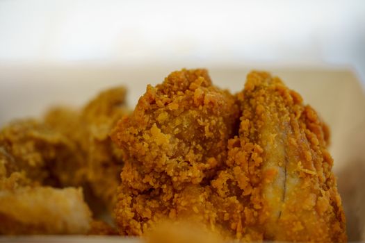 Close-up of delicious fried chicken and soft focus background