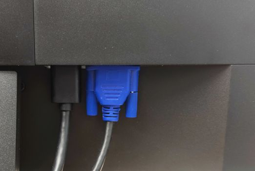 Close-up picture of a VGA jack a computer monitor with a blue head