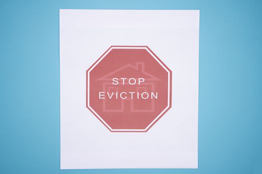 Concept of Tenants Stop Eviction signage printed on grunge textured paper