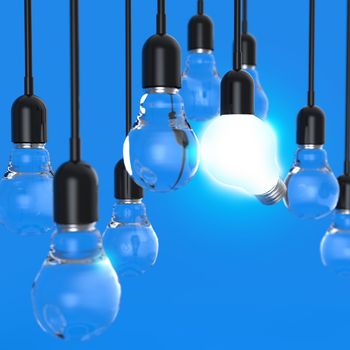 creative idea and leadership concept light bulb on blue background