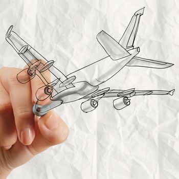 hand drawing airplane with crumpled paper background as concept