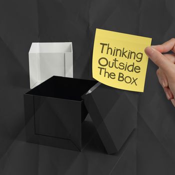 thinking outside the box on crumpled sticky note paper as concept