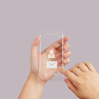 hand use Touch screen mobile phone with email icon as concept 