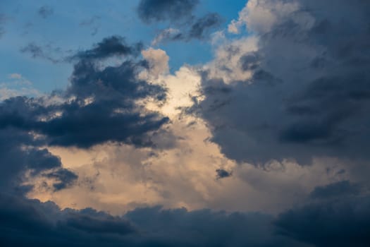 evening summer clouds background in different contrast shades.