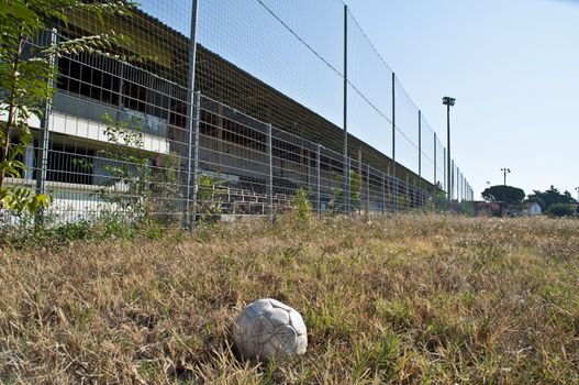 An old football on the pitch of the demolished Stade de la Palla football stadium in Valence, France.