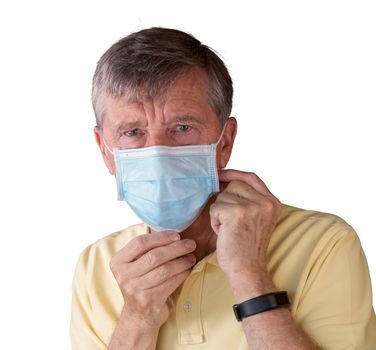 Senior caucasian man adjusting his face mask and looking very tense and concerned about coronavirus epidemic. Isolated against white