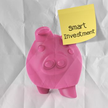 smart investment with sticky note on winner piggy bank as concept