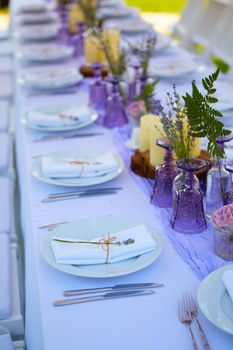 Table set for wedding or another catered event dinner. Shallow dof