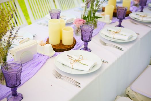 Table set for wedding or another catered event dinner. Shallow dof