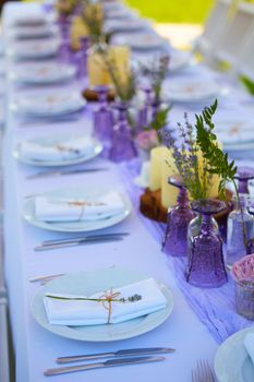 Table set for wedding or another catered event dinner. Shallow dof