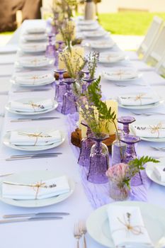 Table set for wedding or another catered event dinner. Shallow dof