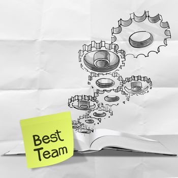 hand drawn gear cog best team with sticky note on crumpled paper as concept