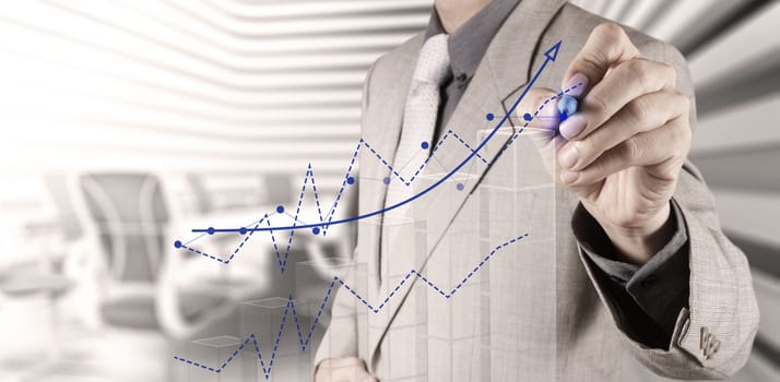 businessman hand draws business success chart concept on virtual screen