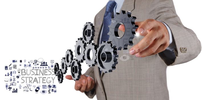 businessman hand show gear cogs and  business strategy as concept