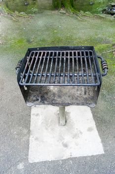 Vertical shot of a well worn barbecue grill.