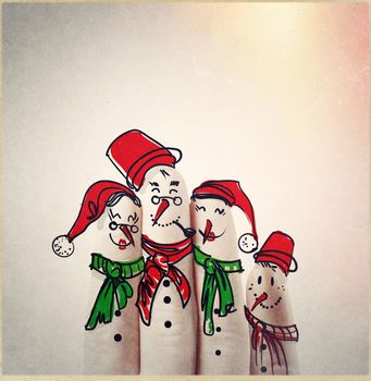 A lovely family hand drawn and finger of snowmen,as concept idea