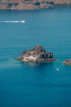 View on the seaside of Santorini island with ship on the sea