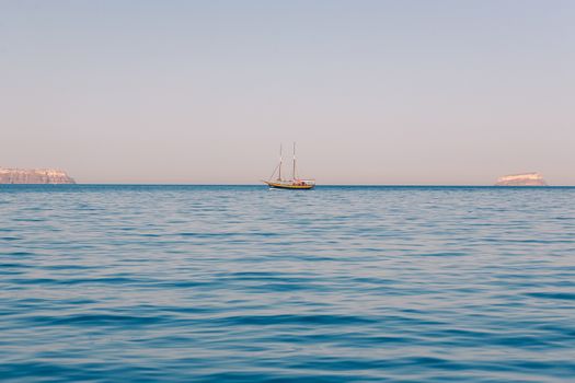 View on the seaside of Santorini island with ship on the sea