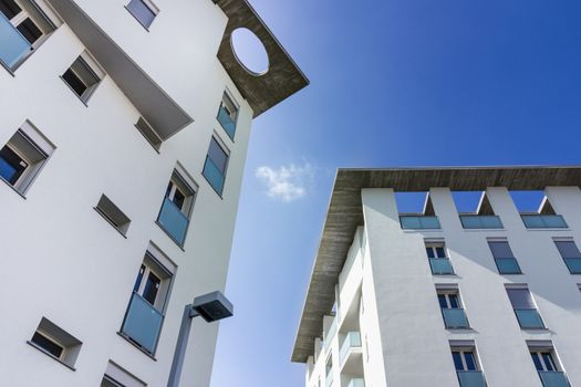 White living house with apartments with sky background