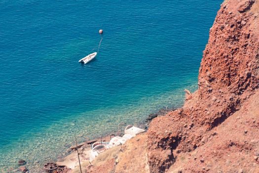 View on the seaside of Santorini island with ship on the sea