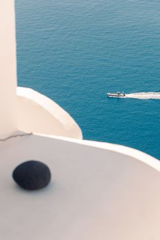 View on the seaside of Santorini island with ship on the sea