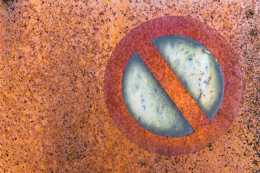 Old road sign on rusted background