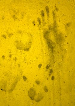 Dirty Hand prints on yellow wall. Ideas for background Halloween
