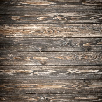 Dark and rustic wooden background. Space for text, copy, lettering and more.