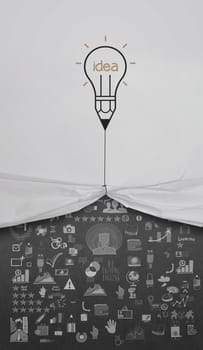 pencil lightbulb draw rope open wrinkled paper show business strategy as concept