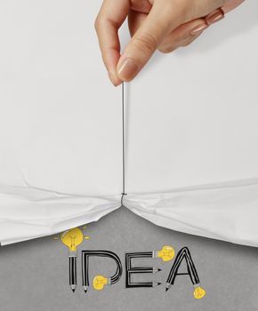 business hand pull rope open wrinkled paper show IDEA design text as concept