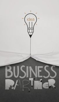 pencil lightbulb draw rope open wrinkled paper show business partner as concept