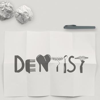 design word DENTIST on white crumpled paper and texture background as concept