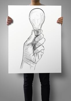 man showing poster of Hand drawn light bulb  as concept