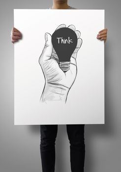 man showing poster of Hand drawn light bulb with THINK word on crumpled paper as concept