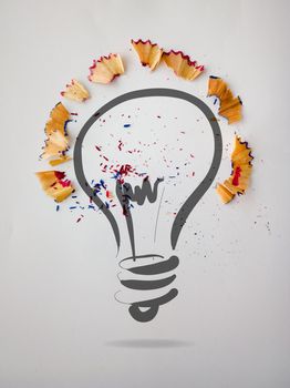 hand drawn light bulb with pencil saw dust on paper background as creative concept