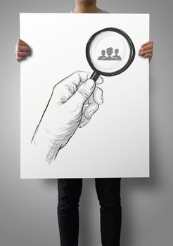 man showing poster of drawing of hand holding magnifier glass looking for employee as concept