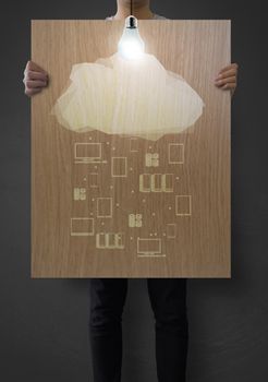 man showing poster of graphic cluod network diagram on wooden board as concept