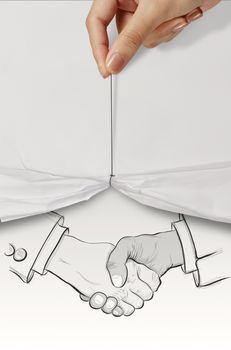 hand drawn handshake sign on crumpled paper as partnership business concept