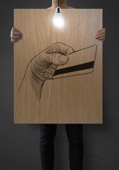 man show poster of hand drawn hand holding up credit card on wooden board  background concept 