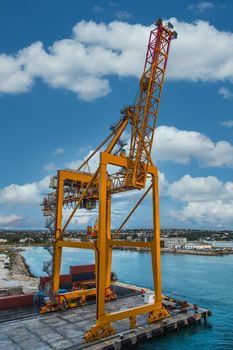 Massive yellow freight crane in harbor of Bridgetown Barbados