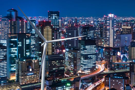 Wind turbine power on the cityscape background