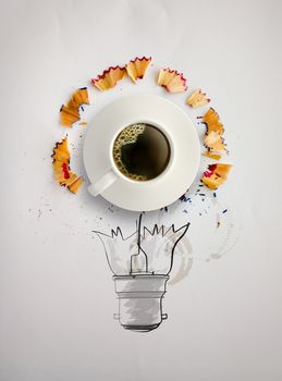 hand drawn light bulb with pencil saw dust and 3d cup of coffee on paper background as creative concept 