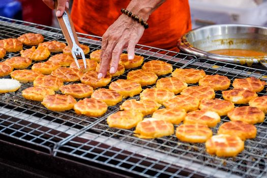 Grilled sticky rice with egg (Khao Jee) street food in Thailand