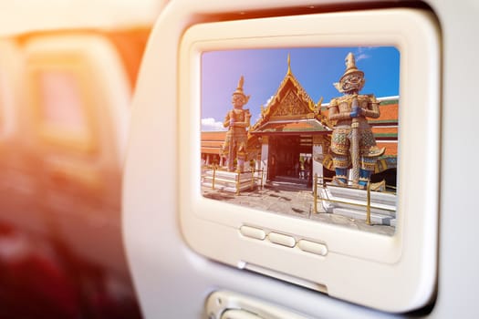 Aircraft monitor in front of passenger seat showing Gaint gate in Thailand