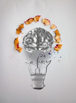 hand drawn light bulb with pencil saw dust and 3d brain icon on paper background as creative concept 