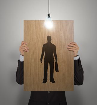 businessman hand with wooden poster choosing people icon as human resources concept 