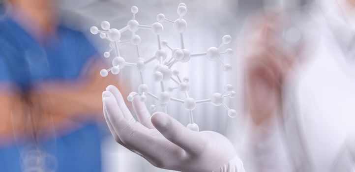 scientist doctor hand holds virtual molecular structure in the lab as concept