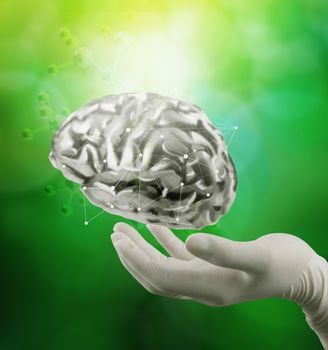 doctor neurologist hand show metal brain with green background as concept 